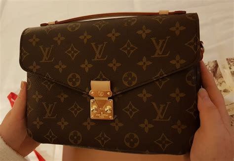 como saber si un bolso louis vuitton es original|bolsa de marca Louis Vuitton.